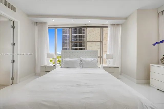 a large bathroom with a sink and a large mirror