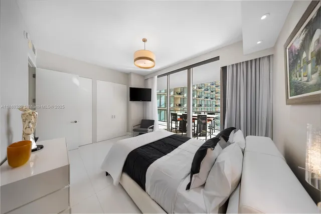 a view of living room with furniture and potted plant