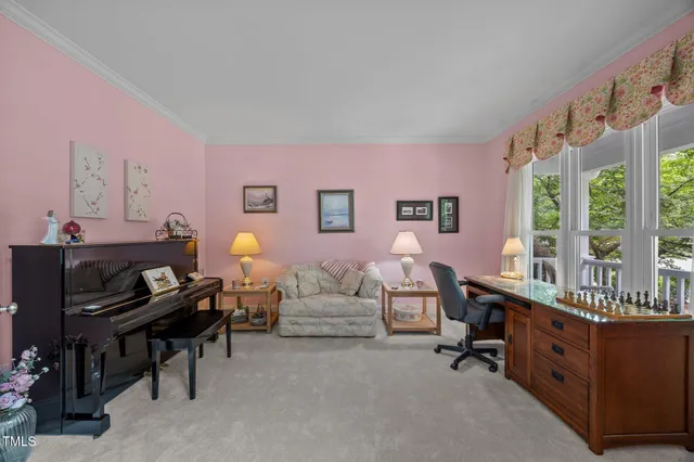 a living room with furniture cabinets and window