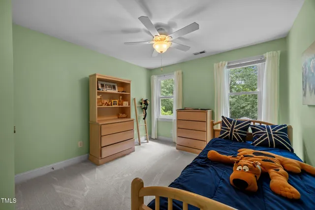 a bedroom with furniture and a window
