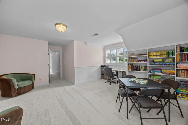 a view of a livingroom with furniture and window