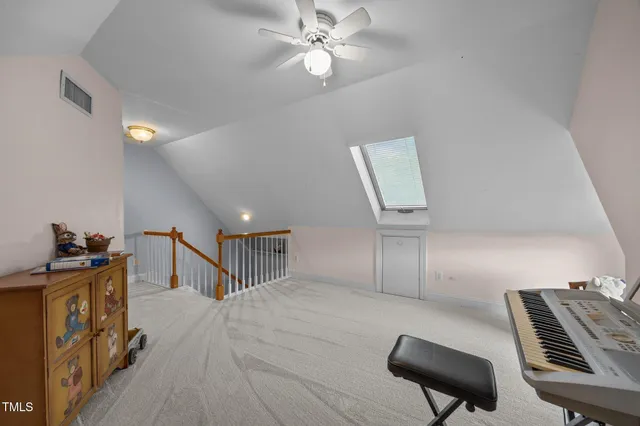 a hallway with furniture and a piano