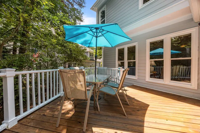 a view of a two chairs and table in the balcony