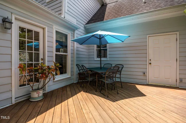 a view of balcony and patio with wooden floor