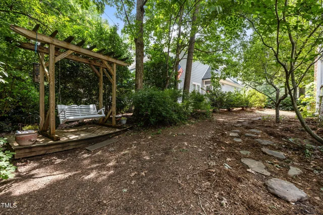 a view of a tree in front of a house