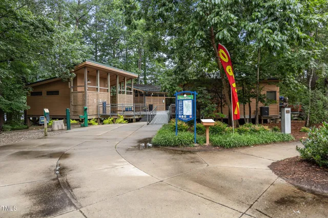 a front view of a house with a yard and a garage