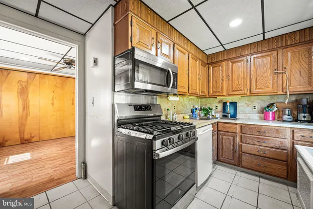 a kitchen with stainless steel appliances granite countertop a stove and a refrigerator