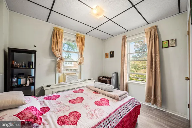 a bedroom with a bed and a table