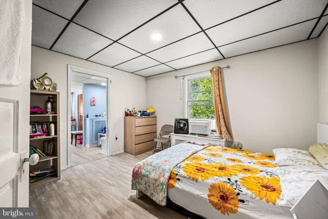 a bedroom with a bed and a table