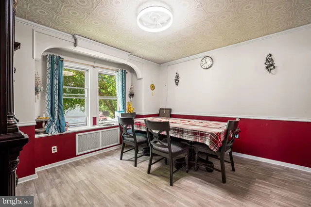 a view of a dining room with furniture and windows