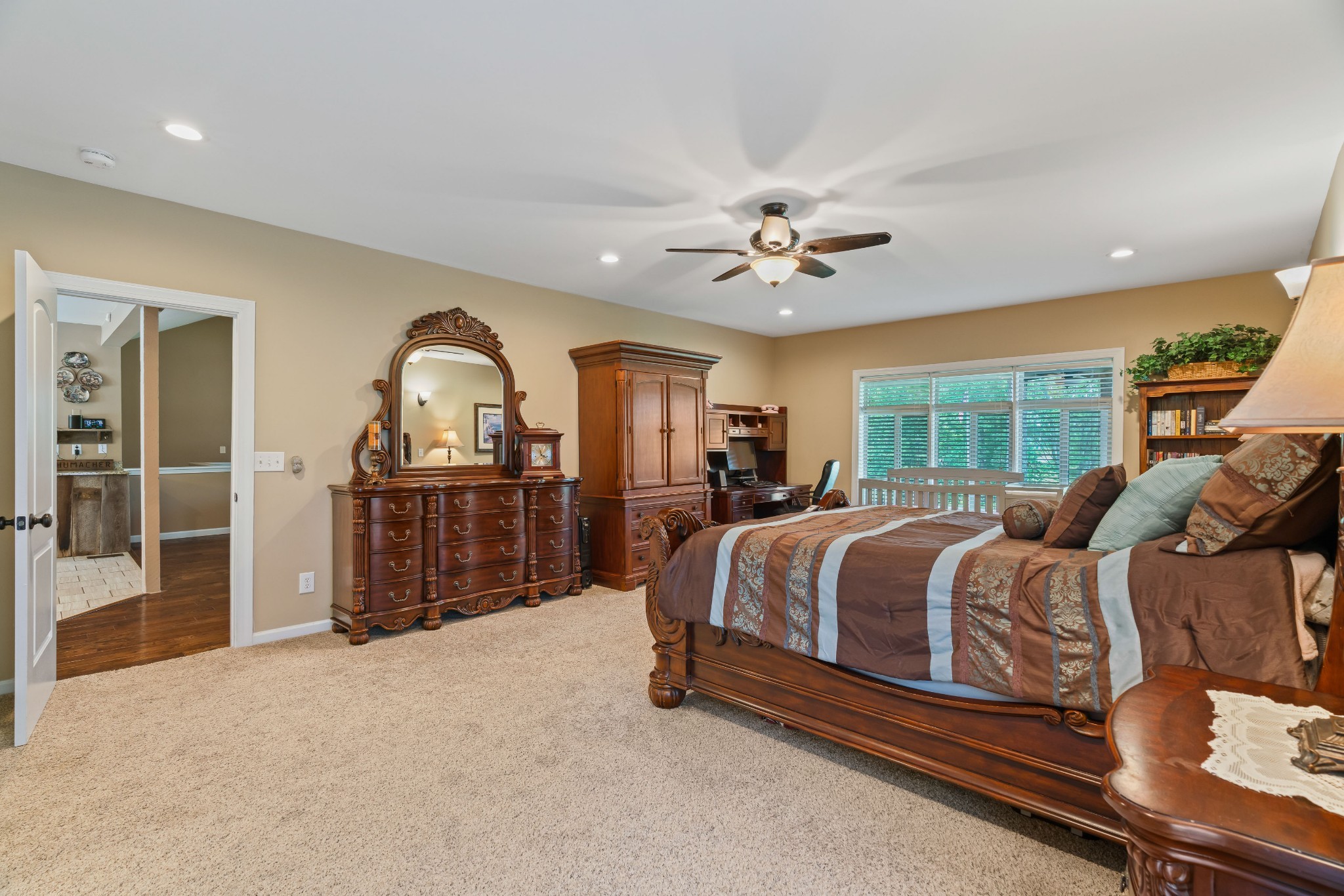 725 Fowler Ford Road Portland, TN 37148 - Photo 16 of 66 a spacious bedroom with a bed a dresser and large windows