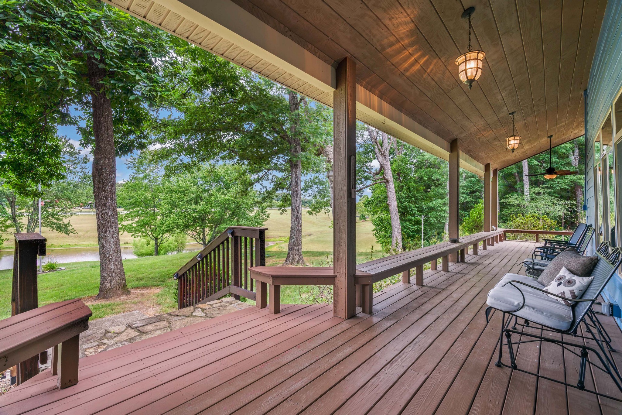 725 Fowler Ford Road Portland, TN 37148 - Photo 4 of 66 a view of a patio with wooden floor table and chairs