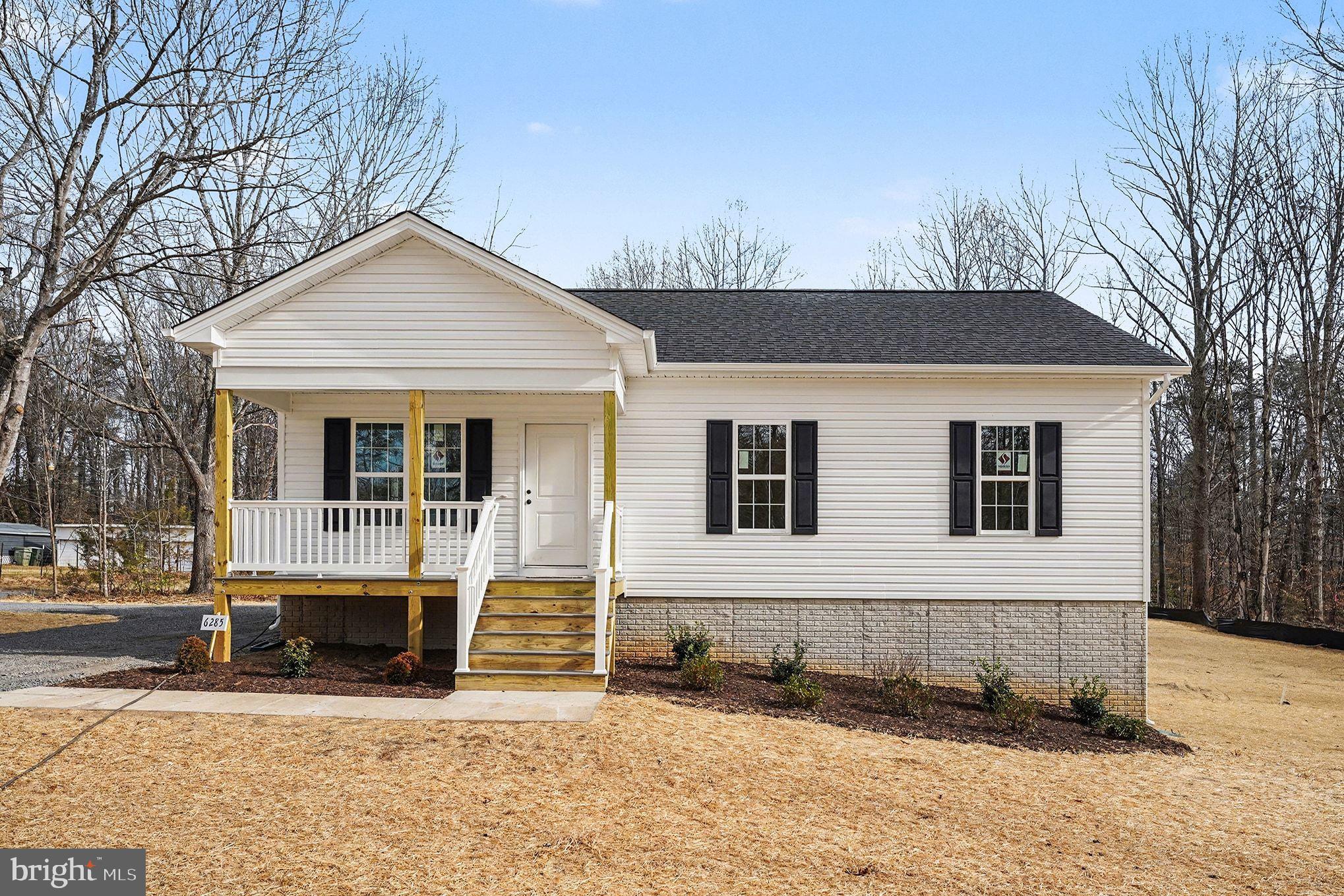 6285 Waterford Road Rixeyville, VA 22737 - Photo 11 of 36 a front view of a house with a yard covered with snow in front of house