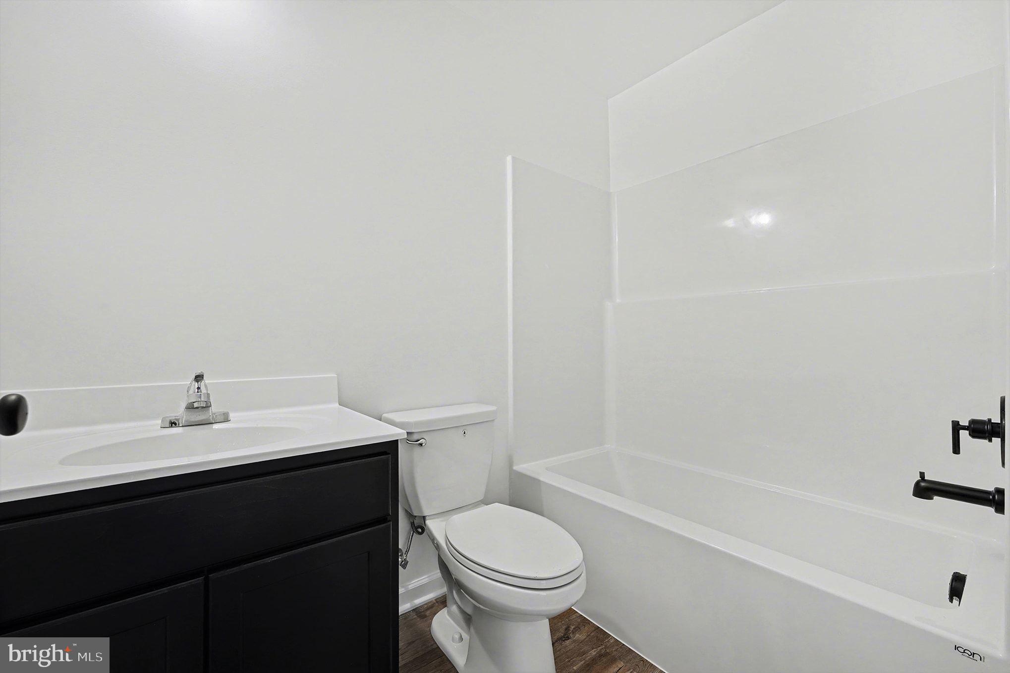 6285 Waterford Road Rixeyville, VA 22737 - Photo 20 of 36 a bathroom with a sink toilet and shower