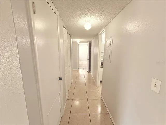 a view of a house with backyard porch and sitting area