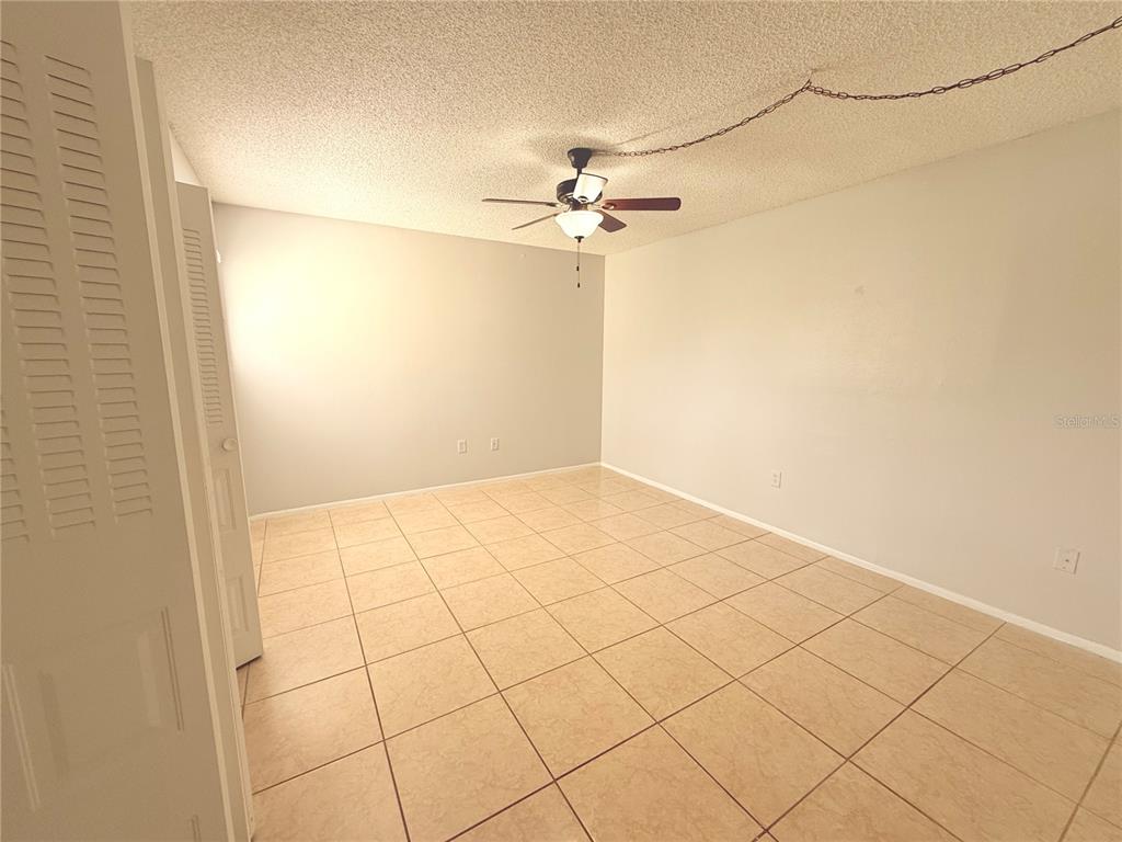 910 Lake Destiny Road, Unit E Altamonte Springs, FL 32714 - Photo 13 of 29 an empty room with fan