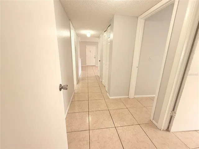 a view of a house with a yard balcony and sitting area