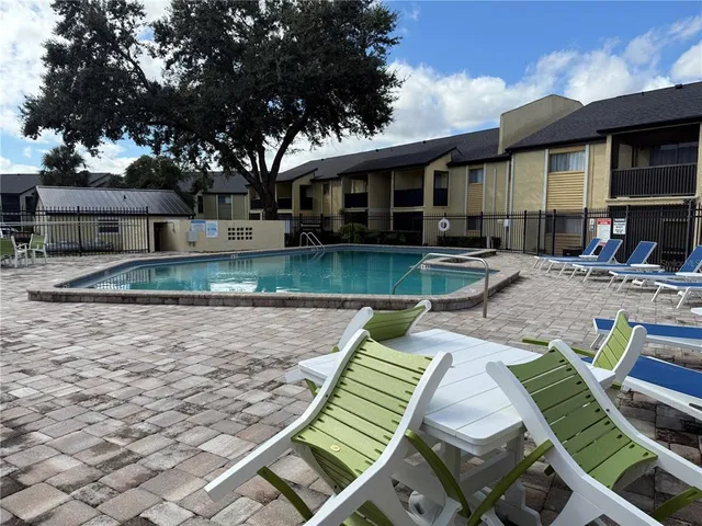 a kitchen with a sink a stove and cabinets