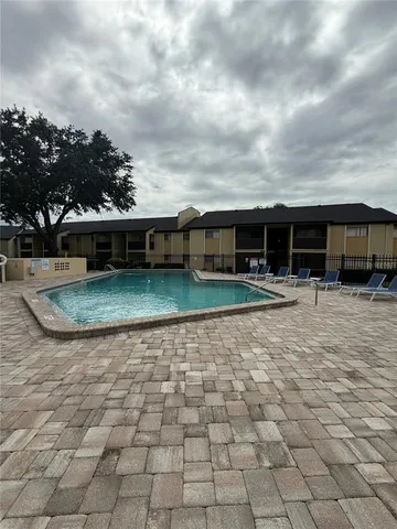 a kitchen with a sink a stove and cabinets