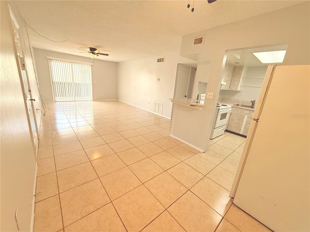 910 Lake Destiny Road, Unit E Altamonte Springs, FL 32714 - Photo 2 of 29 a view of a refrigerator and window in a room