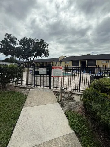 a kitchen with stainless steel appliances granite countertop a sink and a refrigerator