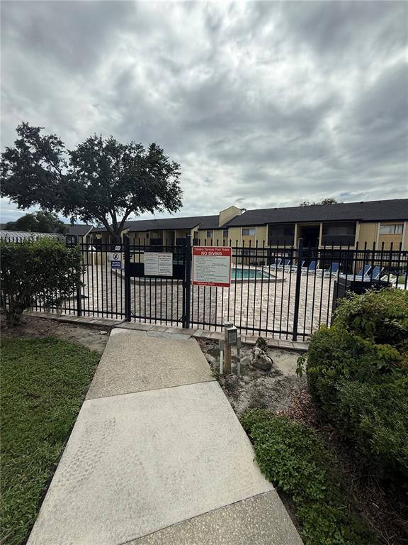 910 Lake Destiny Road, Unit E Altamonte Springs, FL 32714 - Photo 22 of 29 front view of a house with a garden