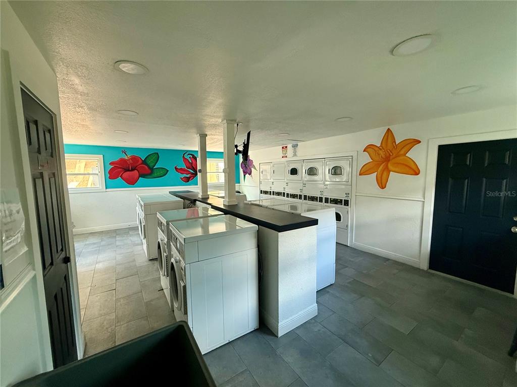 910 Lake Destiny Road, Unit E Altamonte Springs, FL 32714 - Photo 25 of 29 a kitchen with stainless steel appliances granite countertop a sink and a refrigerator
