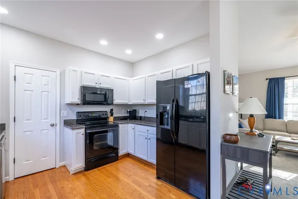 a kitchen with stainless steel appliances a refrigerator stove and sink