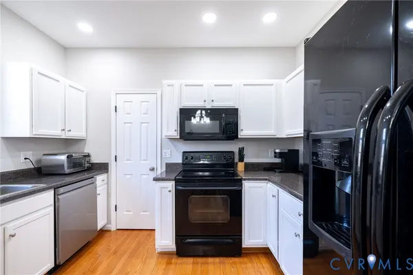 a kitchen with a sink stove and refrigerator