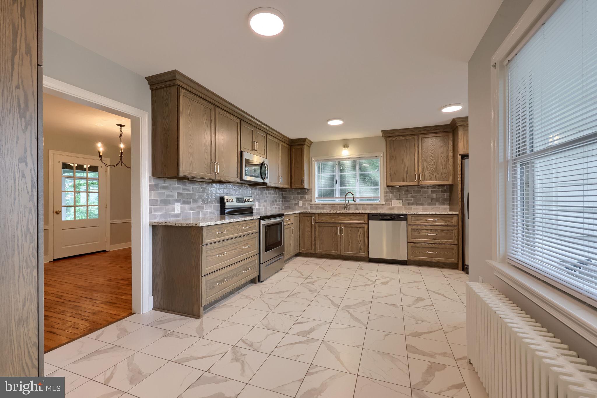 145 Weaver Road Lancaster, PA 17603 - Photo 26 of 87 a kitchen with stainless steel appliances granite countertop a stove sink and cabinets