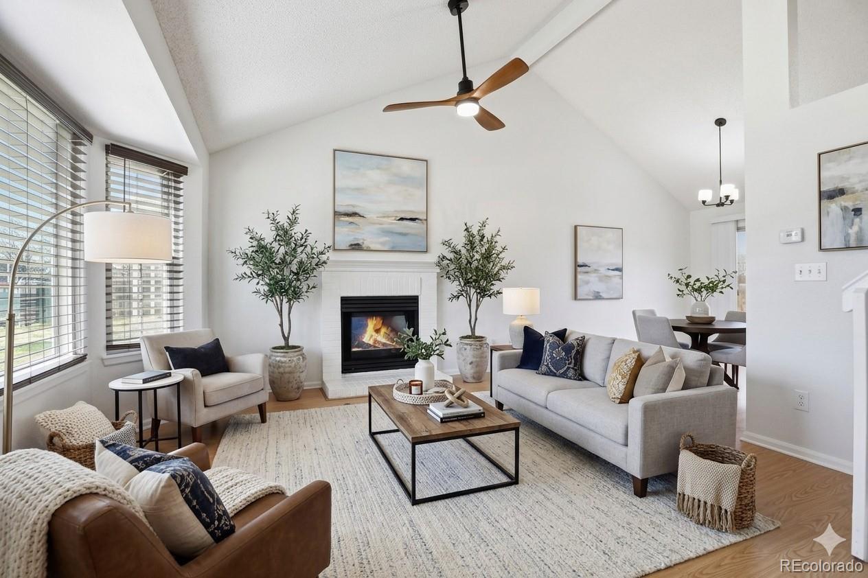 4381 Perth Circle Denver, CO 80249 - Photo 1 of 35 a living room with furniture and a fireplace