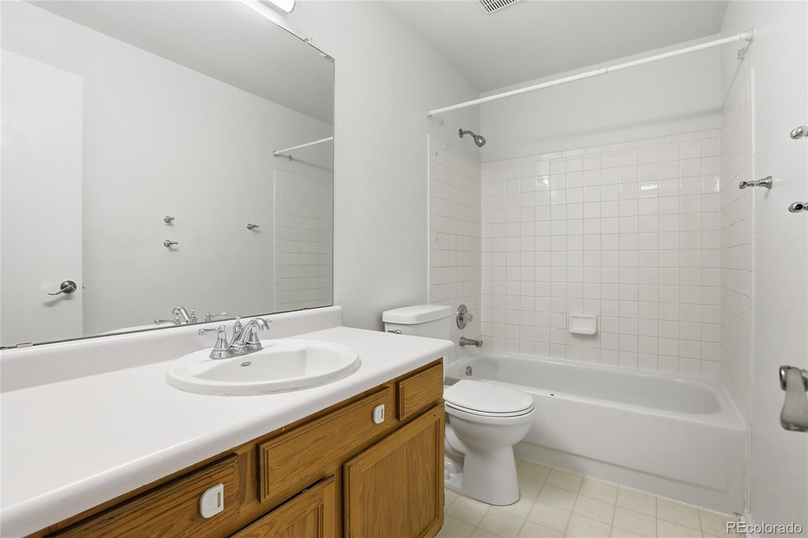 4381 Perth Circle Denver, CO 80249 - Photo 19 of 35 a bathroom with a sink toilet and shower