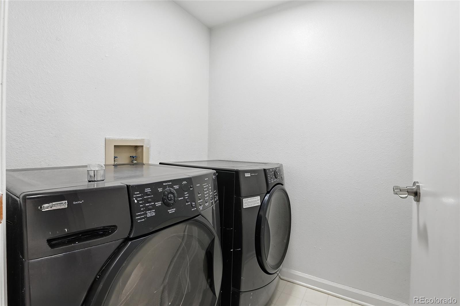 4381 Perth Circle Denver, CO 80249 - Photo 24 of 35 a utility room with dryer and washer