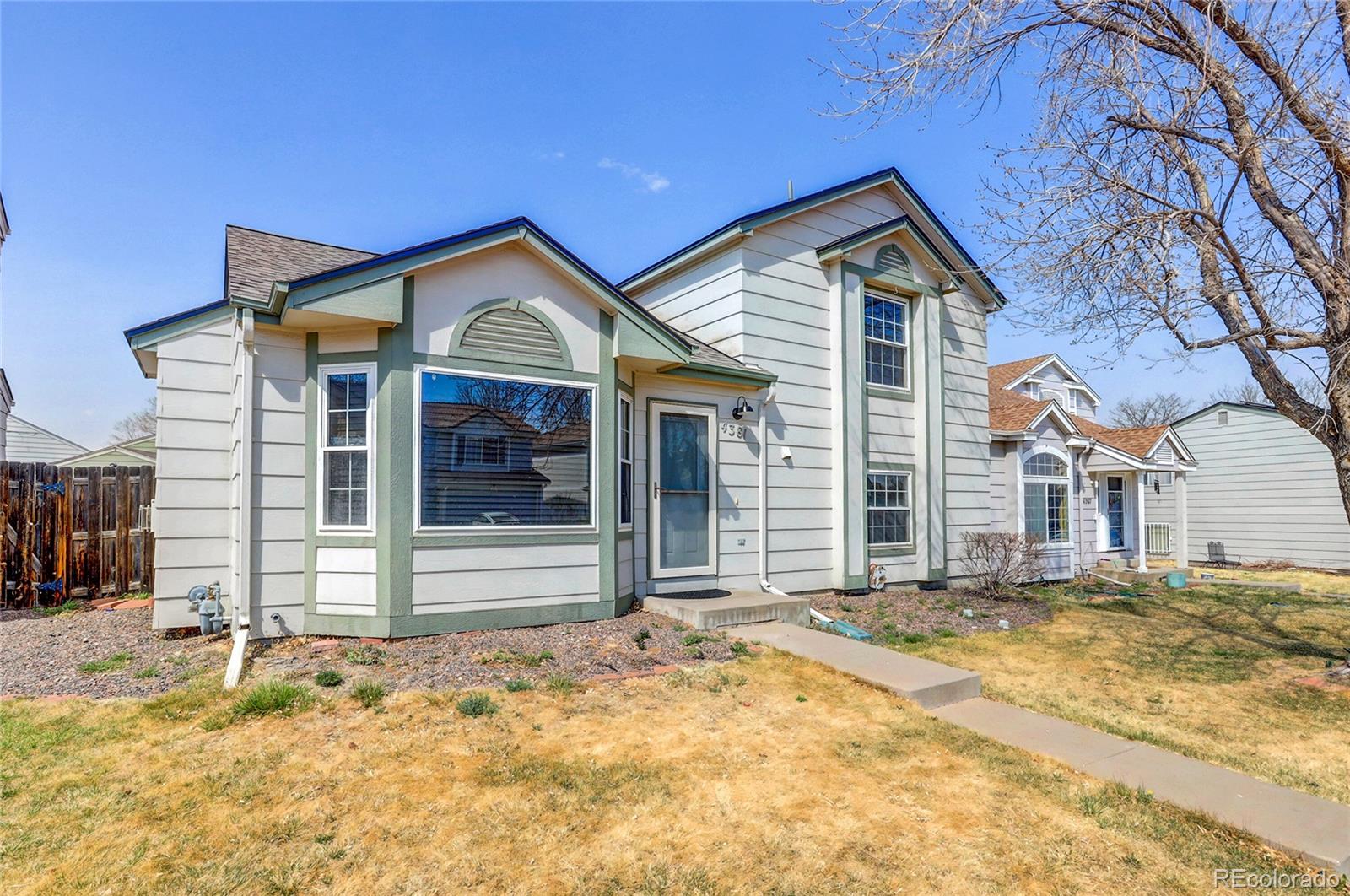 4381 Perth Circle Denver, CO 80249 - Photo 28 of 35 a front view of a house with a yard