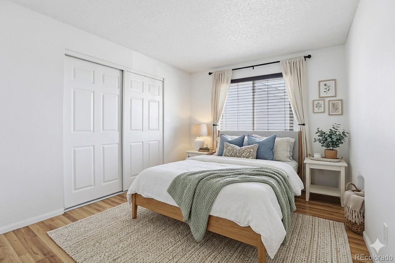 4381 Perth Circle Denver, CO 80249 - Photo 9 of 35 a bedroom with a bed and a window