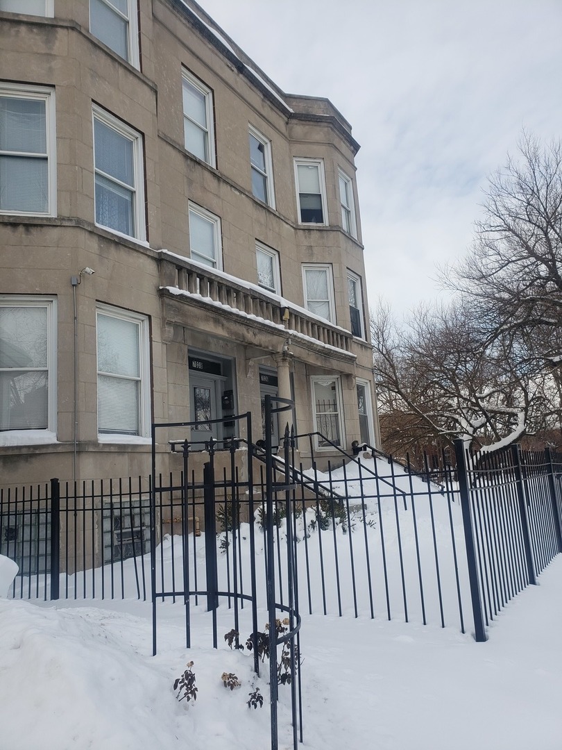7036 South Yale Avenue Chicago, IL 60621 - Photo 1 of 1 a view of a house with iron fence