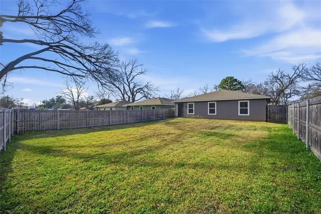 a view of a backyard with a small cabin