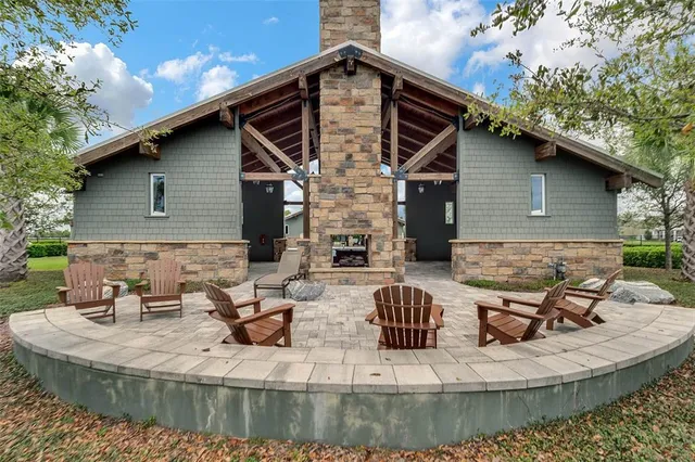 a view of backyard with sitting area