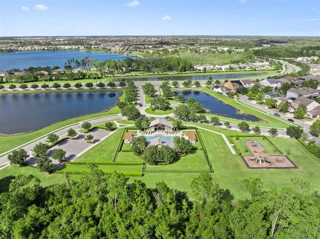 a backyard of a house with lots of green space and garden