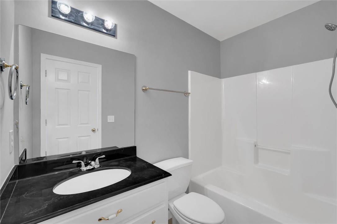 204 Red Maple Way Clemson, SC 29631 - Photo 31 of 48 This clean and bright bathroom features a vanity with a large mirror and a pristine bathtub.
