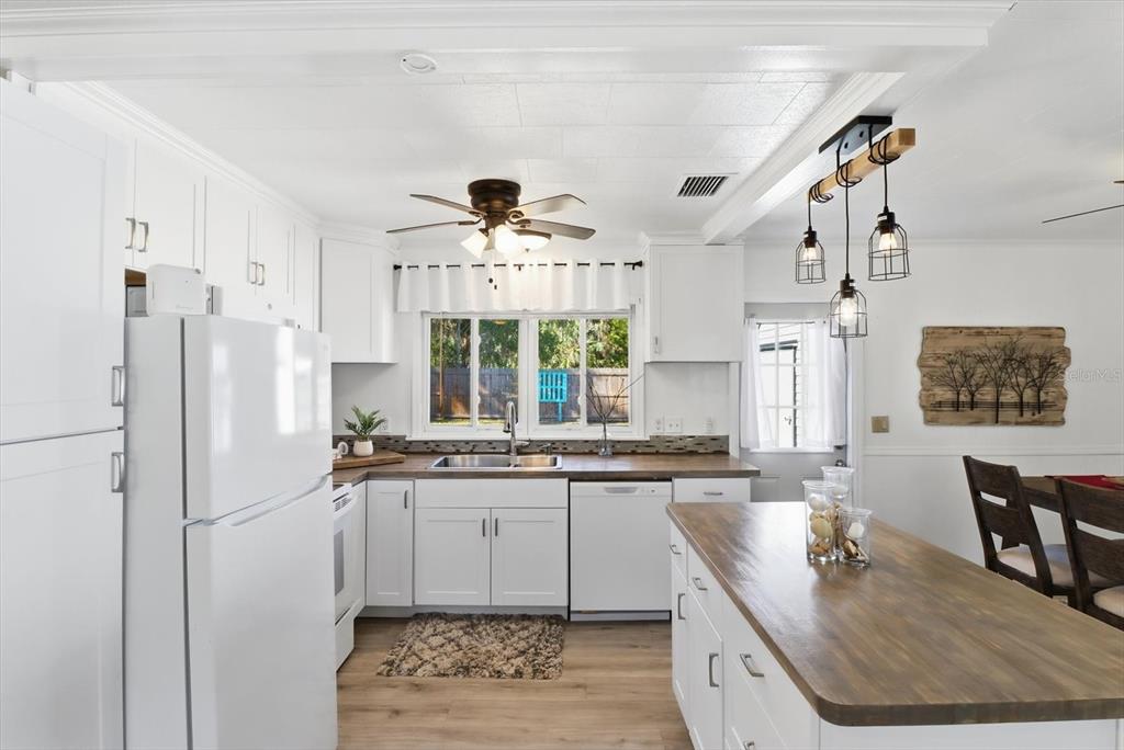 1050 North Midiron Point Crystal River, FL 34429 - Photo 16 of 57 a kitchen with stainless steel appliances granite countertop a sink a stove and a refrigerator