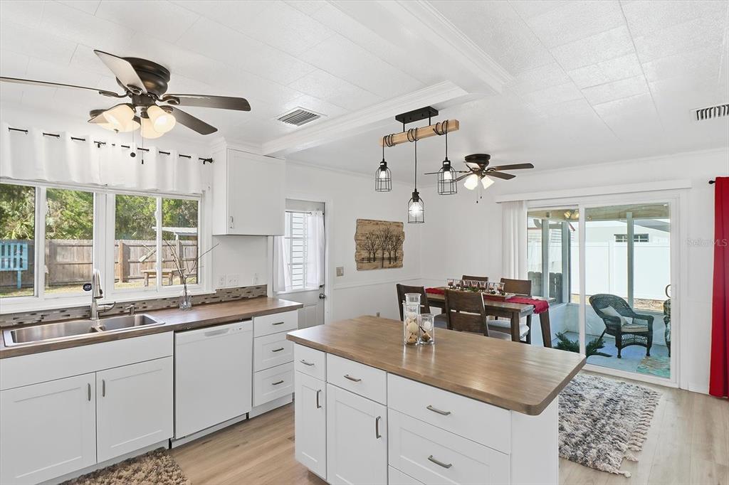 1050 North Midiron Point Crystal River, FL 34429 - Photo 17 of 57 a kitchen with granite countertop a sink a counter top space and living room view
