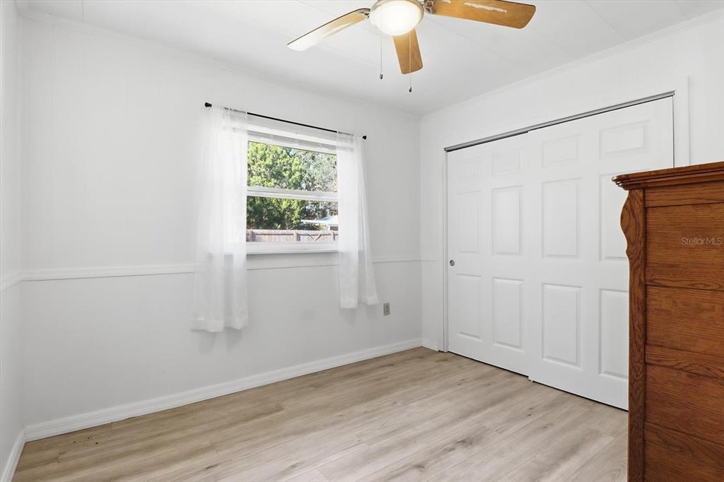 1050 North Midiron Point Crystal River, FL 34429 - Photo 29 of 57 an empty room with wooden floor cabinet and windows