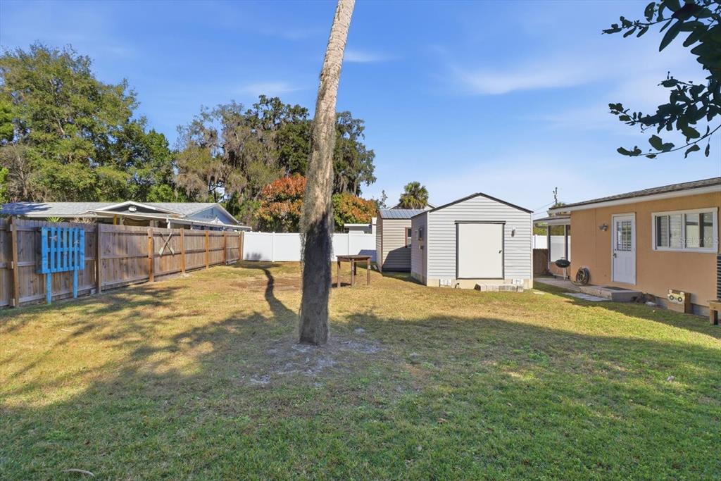 1050 North Midiron Point Crystal River, FL 34429 - Photo 40 of 57 a view of an house with backyard and trees