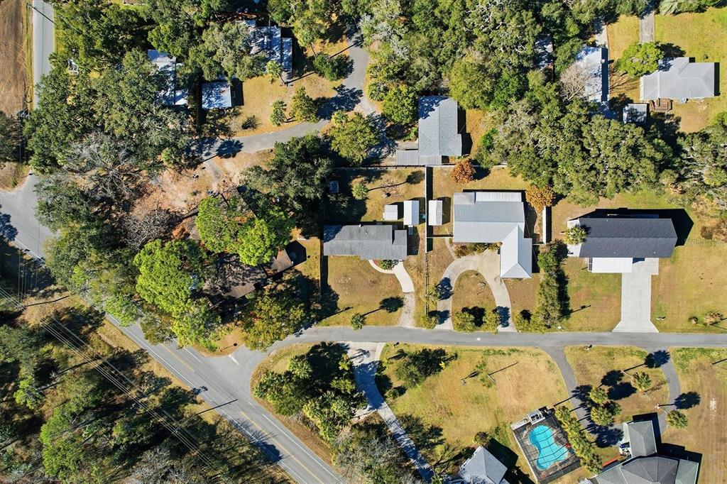 1050 North Midiron Point Crystal River, FL 34429 - Photo 44 of 57 an aerial view of a house with a yard and lake view