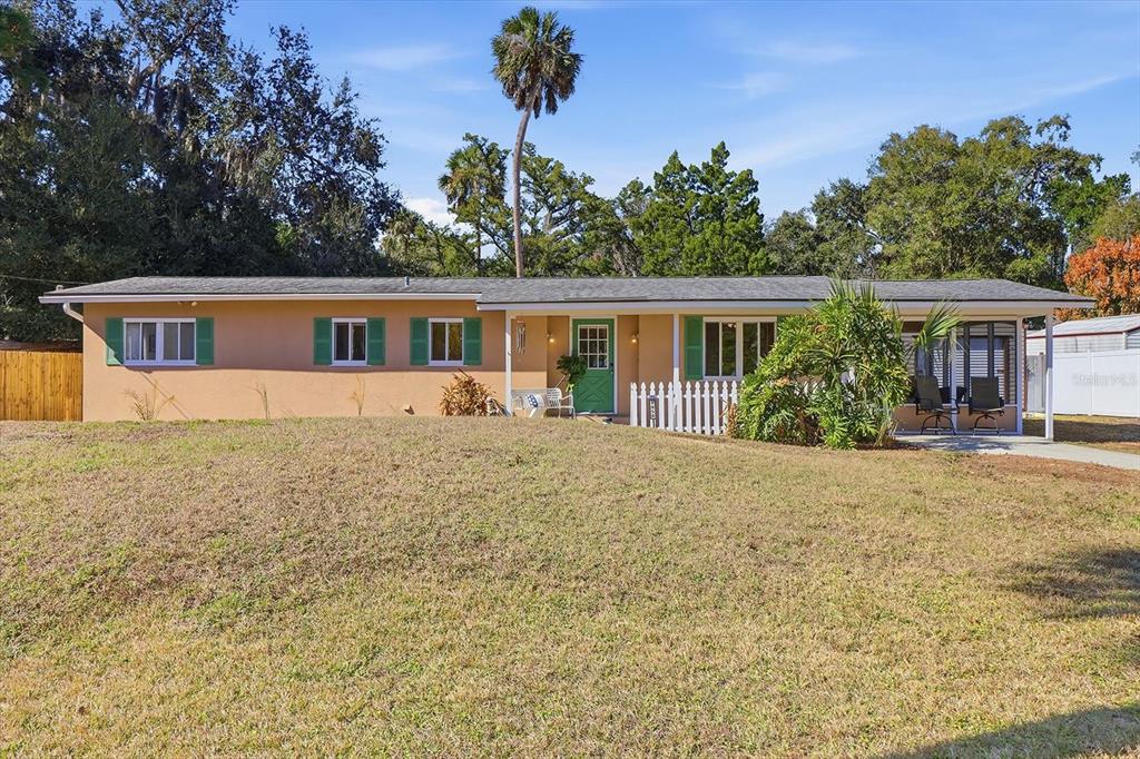 1050 North Midiron Point Crystal River, FL 34429 - Photo 6 of 57 a front view of house with yard and trees around