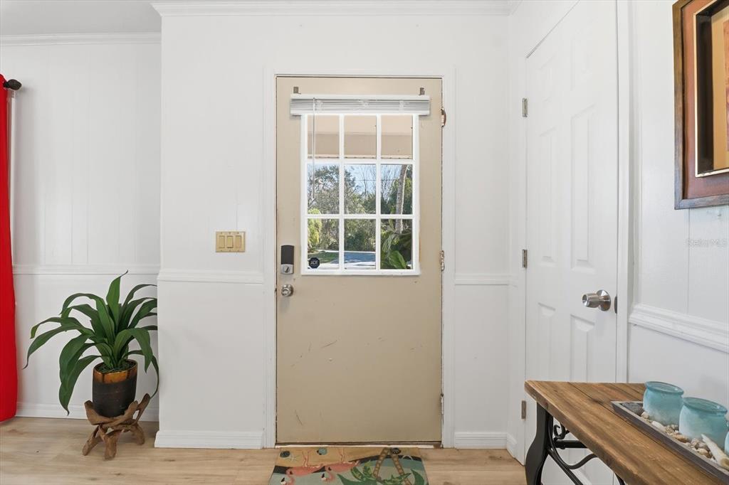 1050 North Midiron Point Crystal River, FL 34429 - Photo 9 of 57 a potted plant sitting on a table next to a window