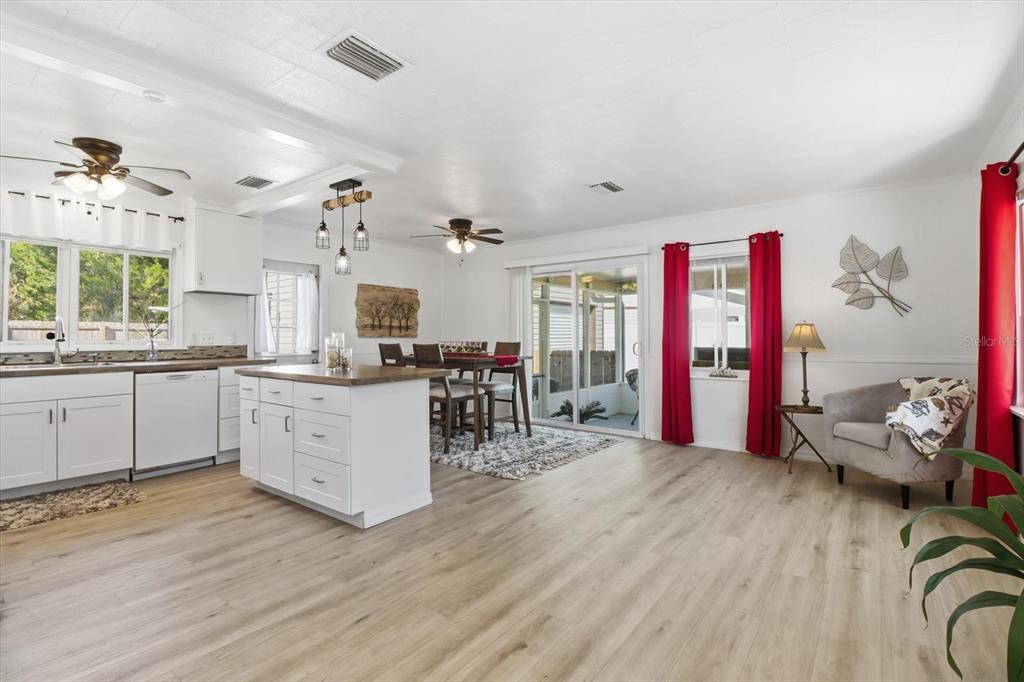 1050 North Midiron Point Crystal River, FL 34429 - Photo 10 of 57 a kitchen with stainless steel appliances granite countertop a stove and wooden floor