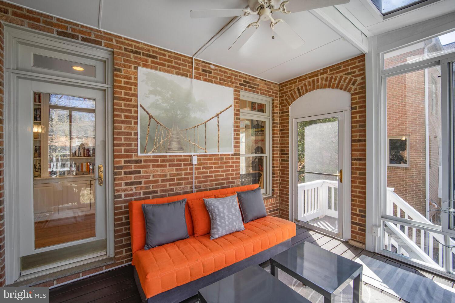 5119 Warren Place Northwest Washington, DC 20016 - Photo 13 of 37 a blue bench sitting in front of a building