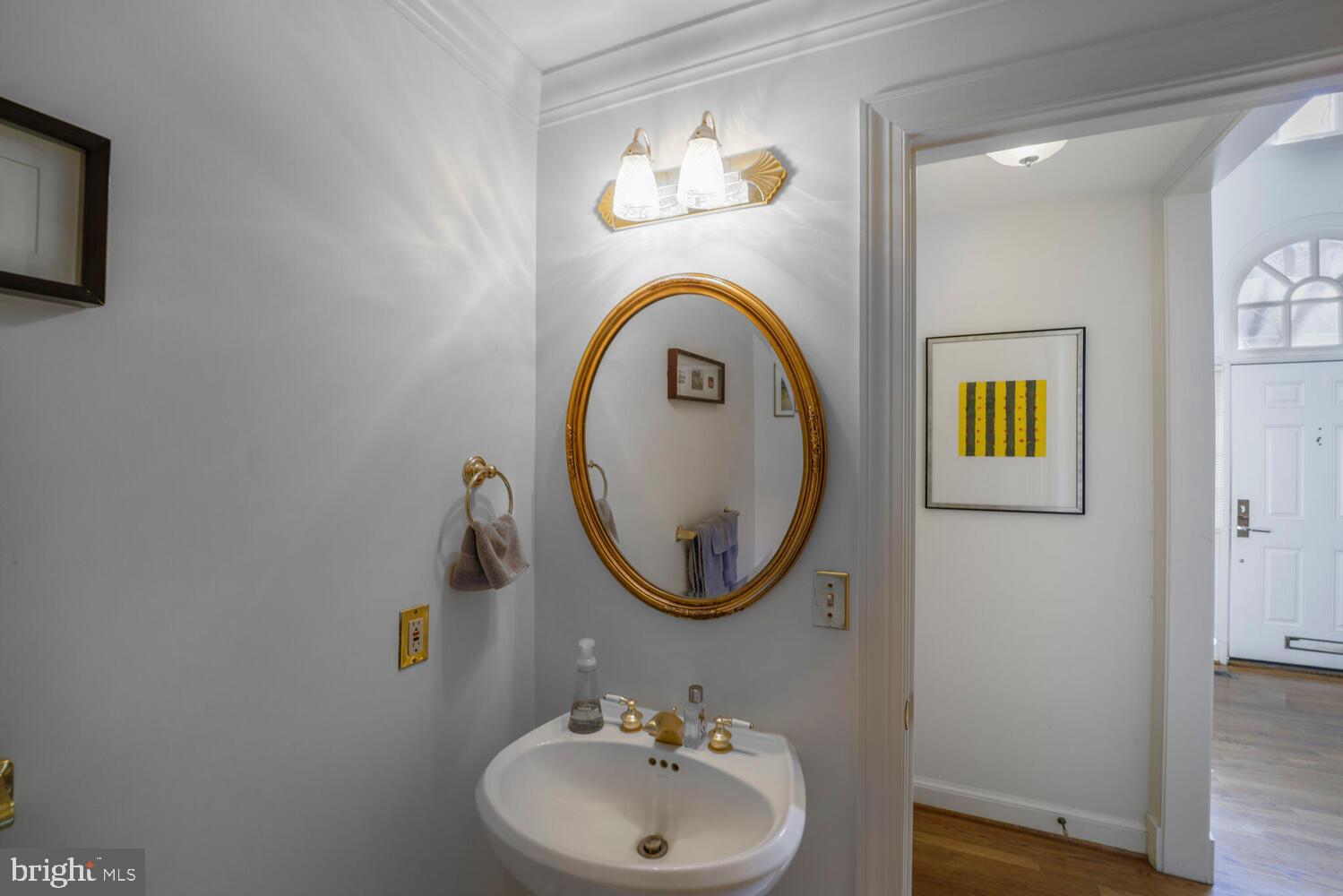 5119 Warren Place Northwest Washington, DC 20016 - Photo 17 of 37 a bathroom with a sink and a mirror
